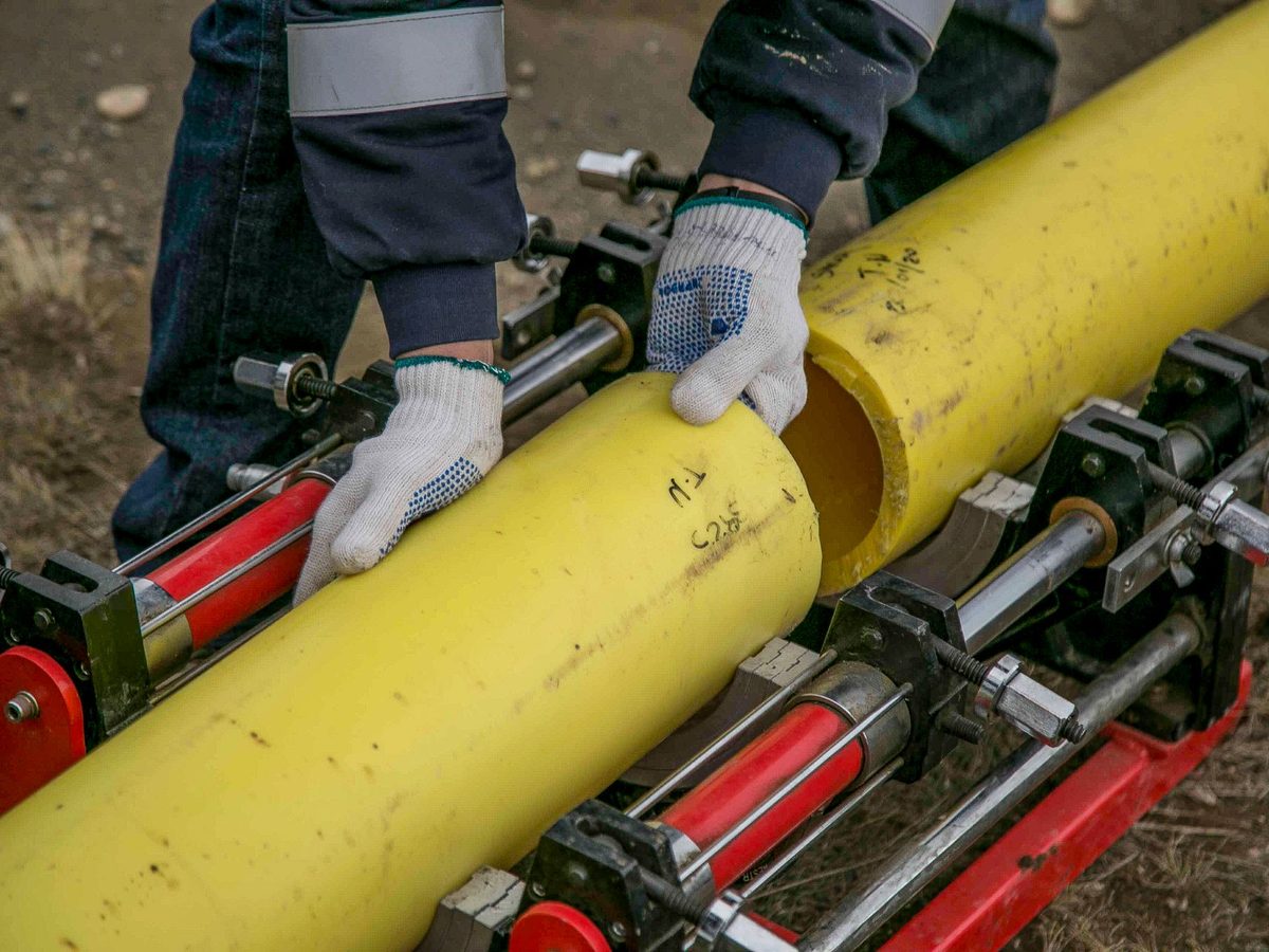 Pipes being installed with hand tools