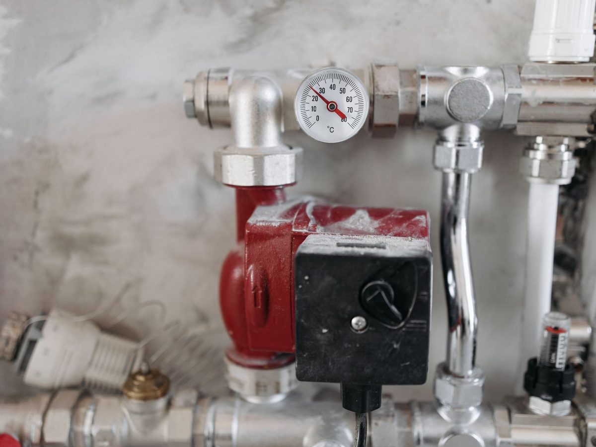 Steel pipework with a pressure gauge on the line